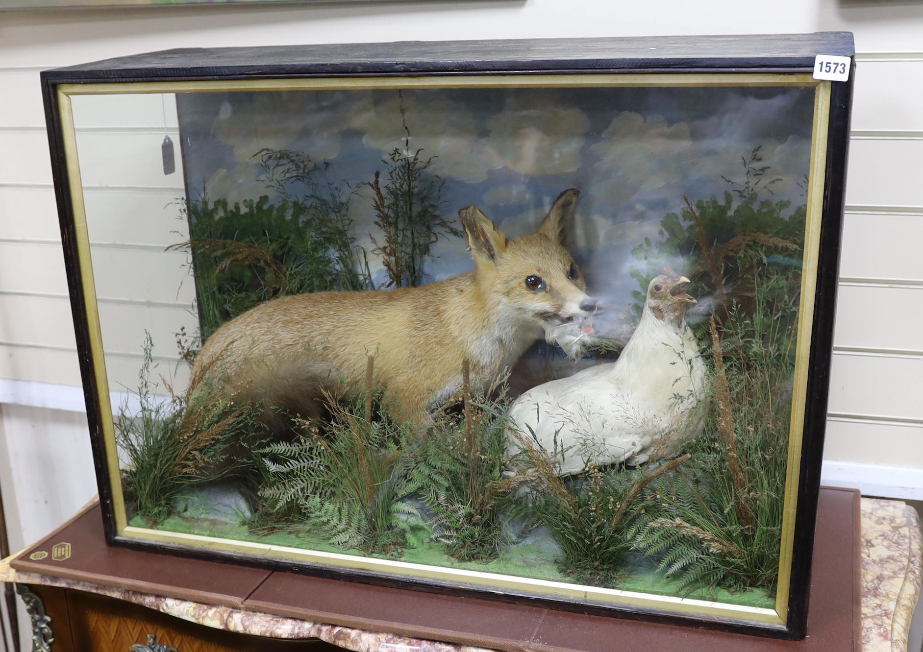 A cased taxidermy fox and chicken, overall 63 x 91 x 32cm